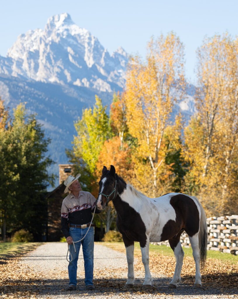 Jonesy and Shadow of Jackson Hole Horse Rescue in front of the Grand Tetons.