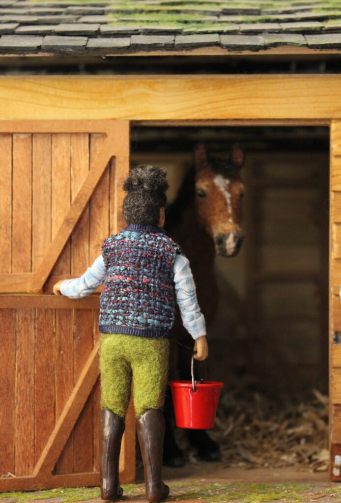 A custom horse, rider, and stable by Tomás Varela.