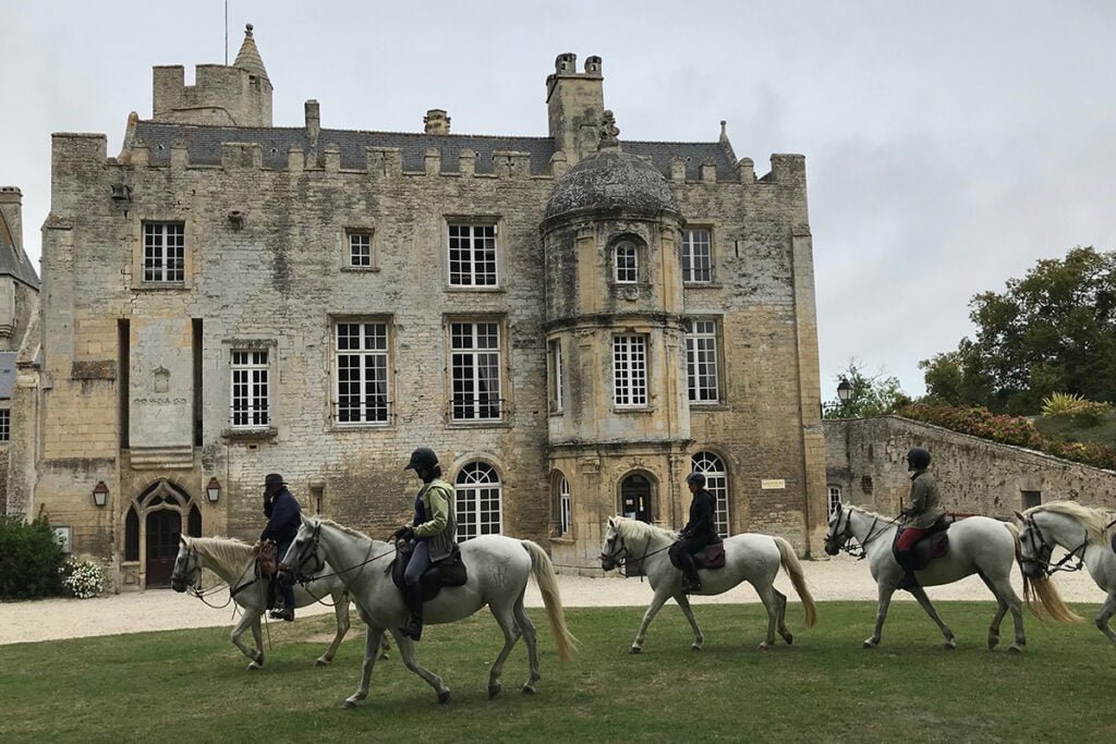 Equestrian travelers at Mont St. Michel in Normandy.